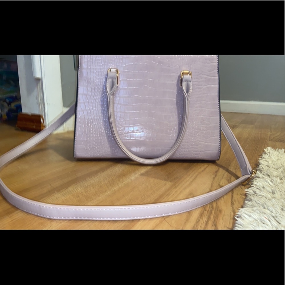 Light purple cross body bag.